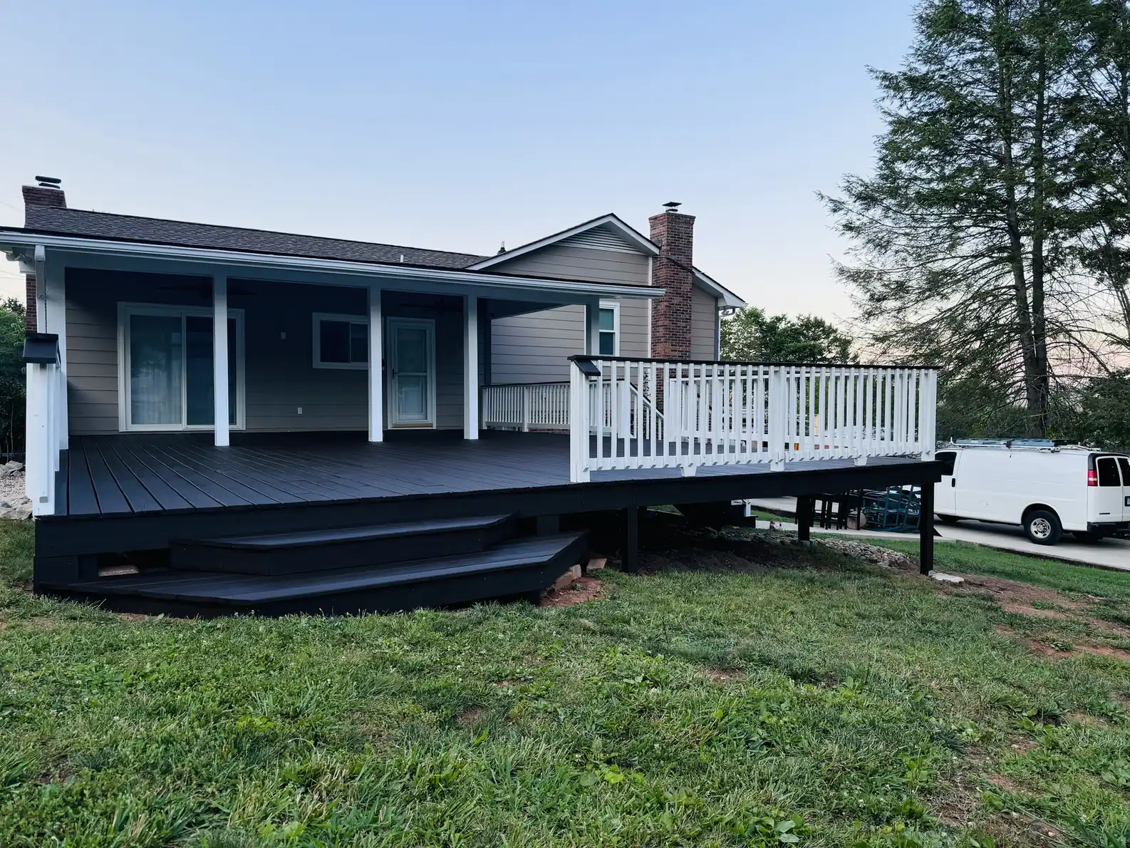 Wraparound deck stained dark gray
