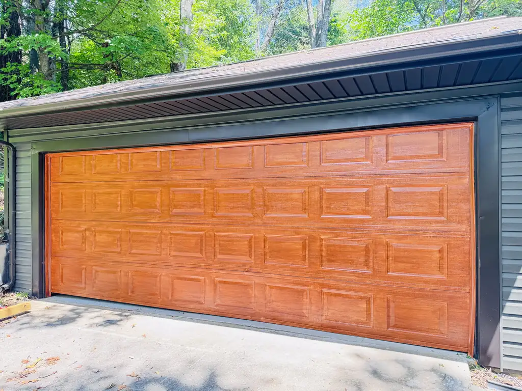 Garage door and dark siding