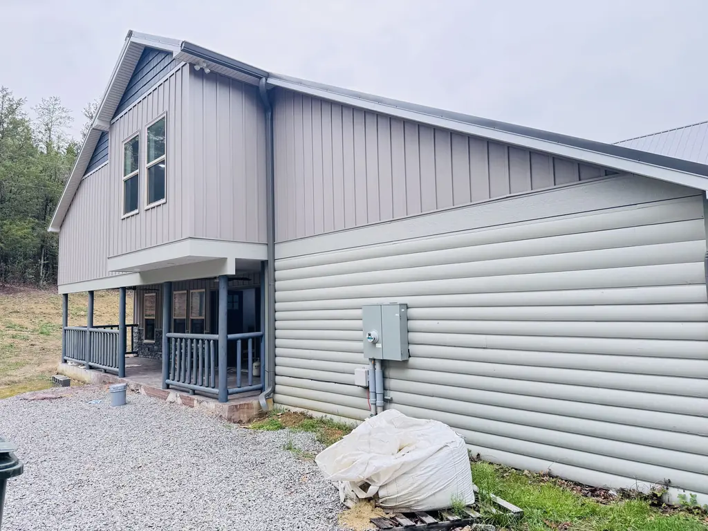 Home with gray siding and porch