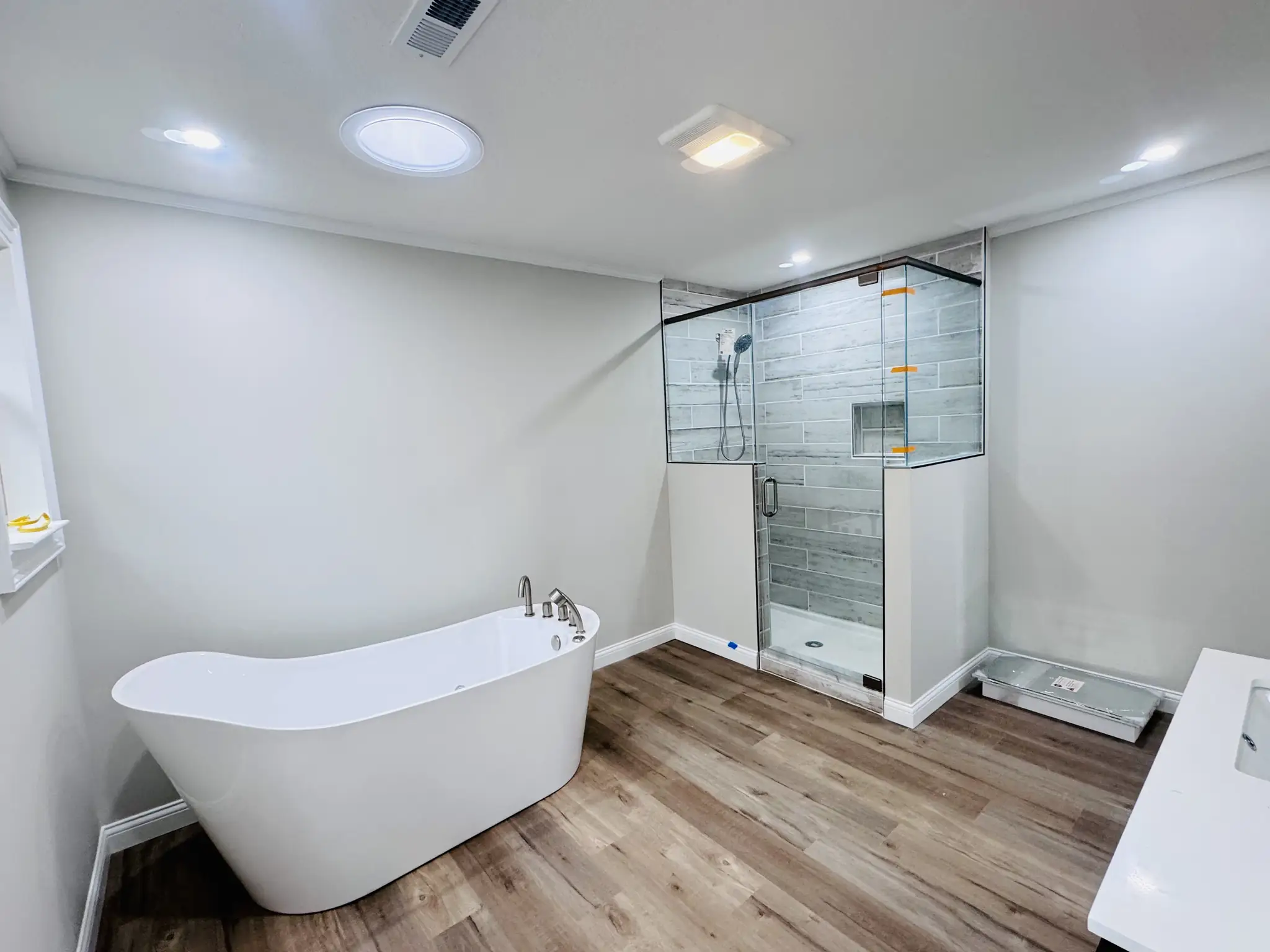 Bathroom with a freestanding tub, freshly painted walls and ceiling