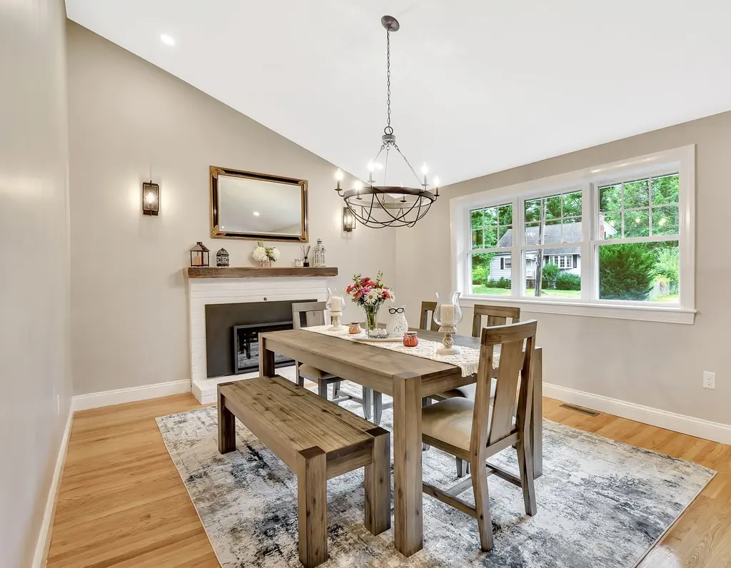 Dining room with a fireplace, walls painted